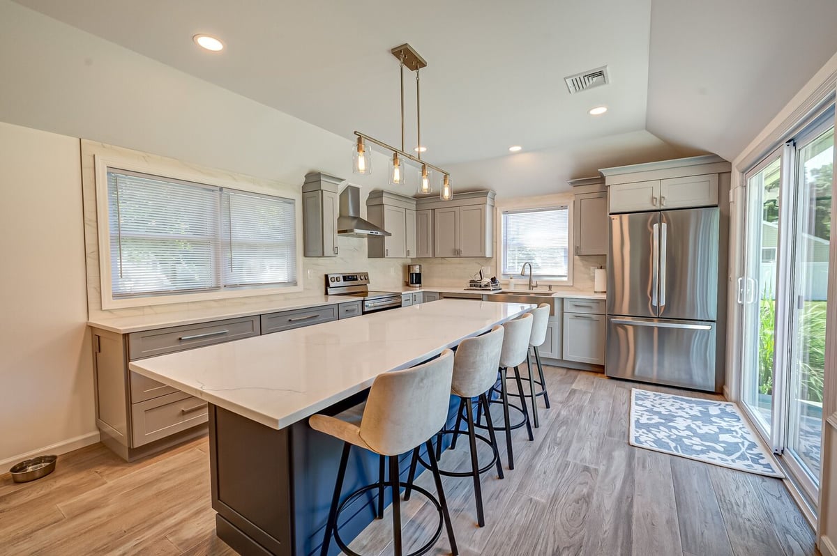 Contemporary kitchen with soft-close cabinetry and modern lighting in Port Jefferson, NY by Long Island Creative Contracting
